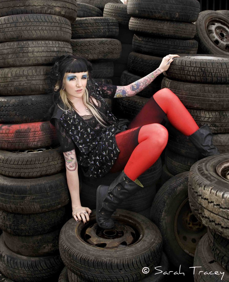 Female model photo shoot of Sarah Tracey Photo in Car Junk Yard