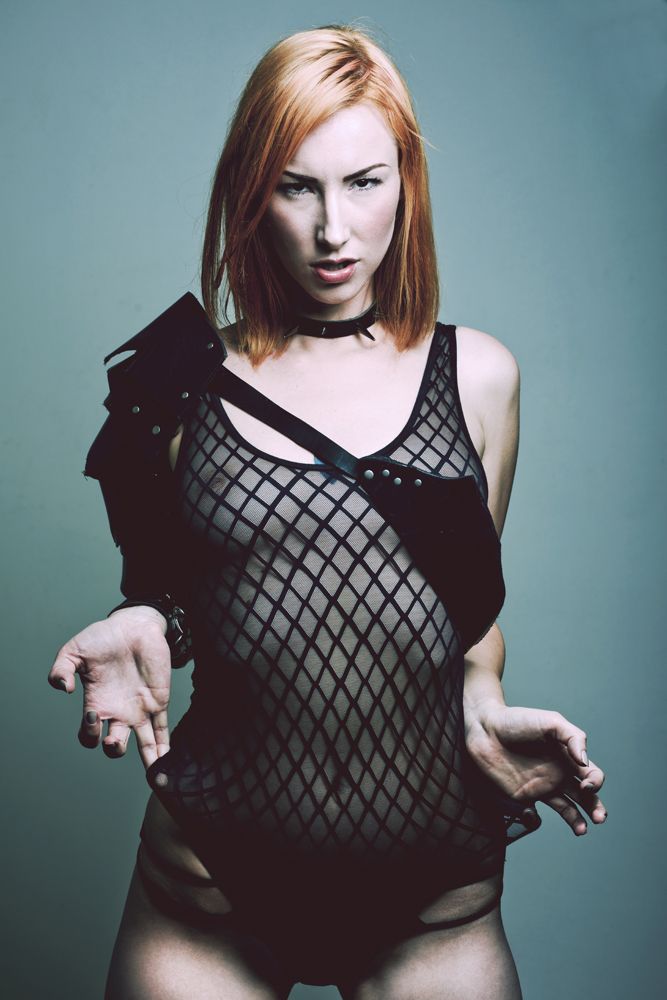 Female model photo shoot of jennyboa by Jeff Waters Photography, clothing designed by Maddox Leather Design