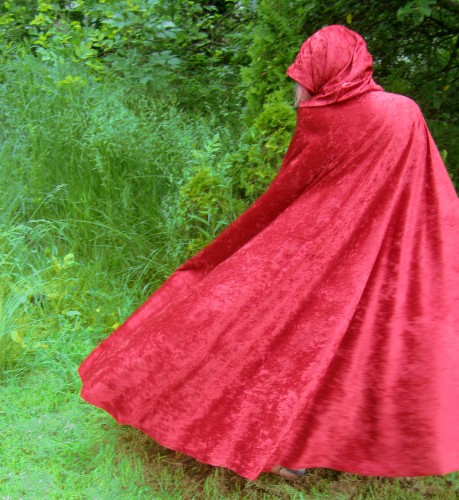 Female model photo shoot of Poppys Wicked Garden in http://www.artfire.com/ext/shop/product_view/PoppysWickedGarden/4755550/Red_Riding_hood_Long_crushed_Velvet_Cape_Cosplay_Costume_fairy_Tale/Clothing/Jackets/Other