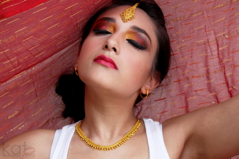 Female model photo shoot of katdesouza, makeup by katdesouza