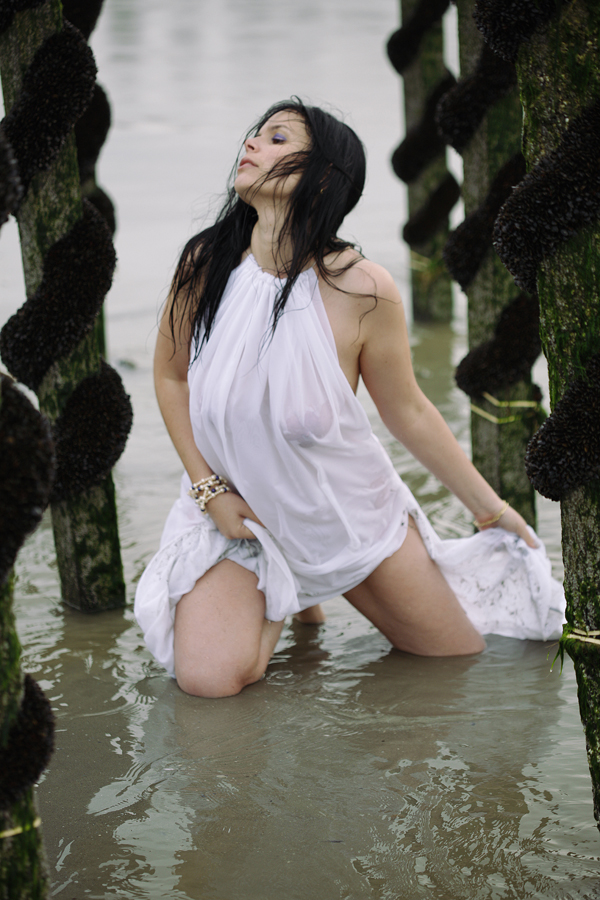 Female model photo shoot of Kiani Strawberry in Sea