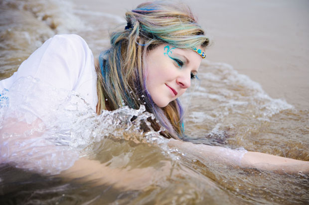 Female model photo shoot of Raini Scott Photography in A really cold beach!