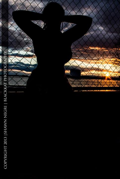 Female model photo shoot of Amiyah Quicks by BlackKat Photography in sunset
