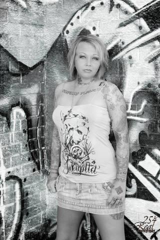 Female model photo shoot of CHARMm in larudes tattoos