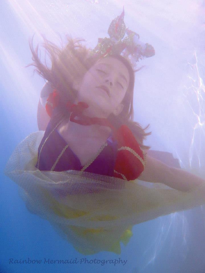 Female model photo shoot of Rainbow Mermaid Photog in TBMM Backyard Pool