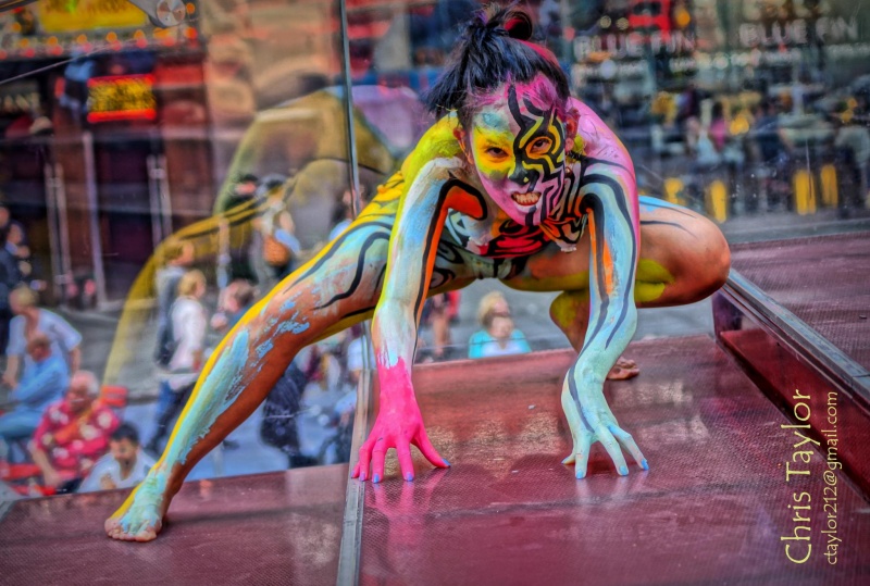 Female model photo shoot of Koy Penguina by ChrisFromBrooklyn in Times Square, body painted by Andy Golub