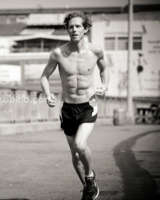 Male model photo shoot of Shirtless Runner