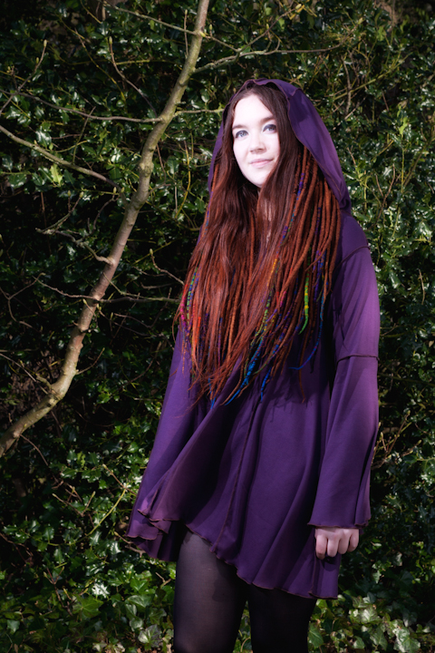 Female model photo shoot of Twisted Pixie Clothing and Purple Elf Queen