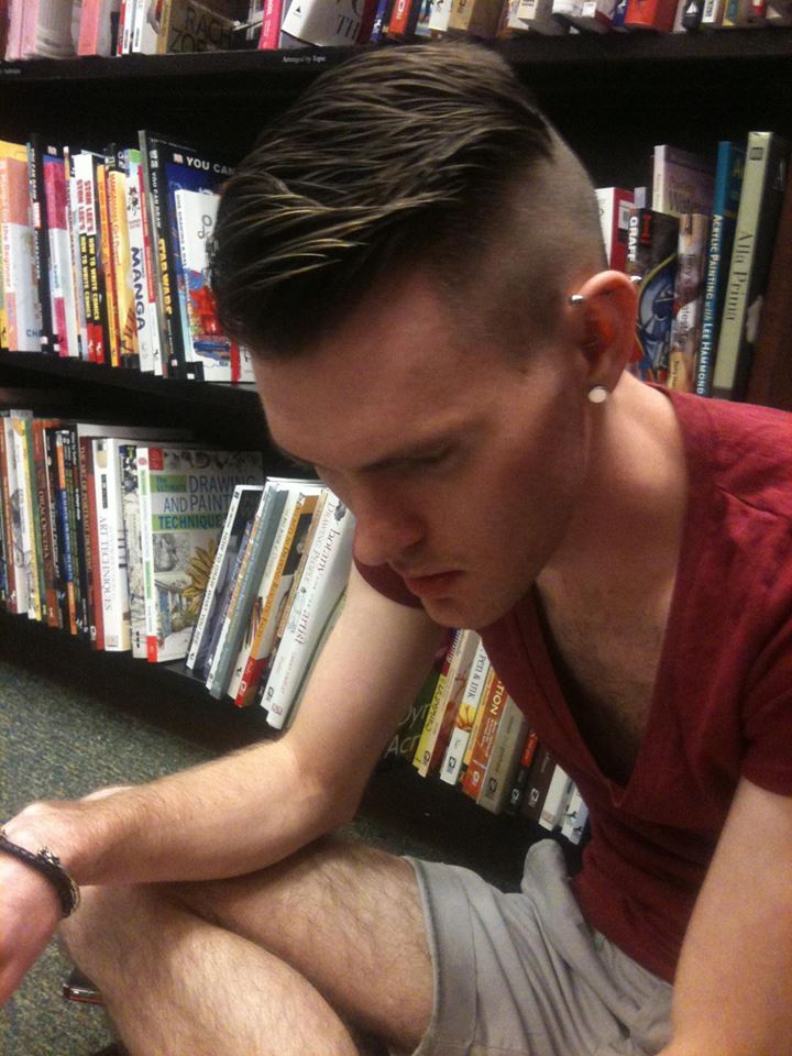 Male model photo shoot of Aaron Mychal in Barnes and Noble... reading a Vogue Paris