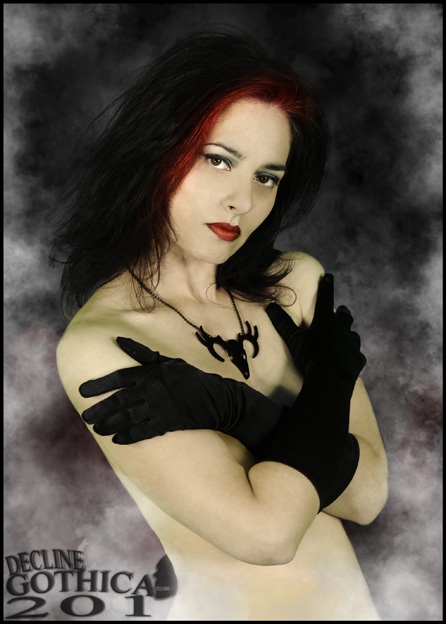 Female model photo shoot of Morticiaa by Dave Charsley, clothing designed by Eustratia