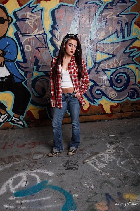 Female model photo shoot of Tara pending stage name by Craig Thomson in Tacoma Graffiti Garages, makeup by Cast of Thousands