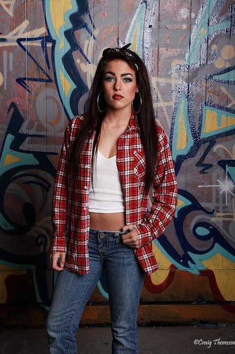 Female model photo shoot of Tara pending stage name by Craig Thomson in Tacoma Graffiti Garages, makeup by Cast of Thousands