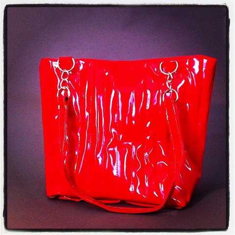 Female model photo shoot of One Tuff Chick in https://www.etsy.com/listing/127782191/red-vinyl-rockabilly-shopper-tote?ref=shop_home_active