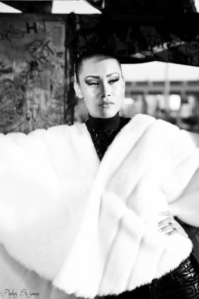 Female model photo shoot of Nia Sky by DOP INC, makeup by Megan Nicol