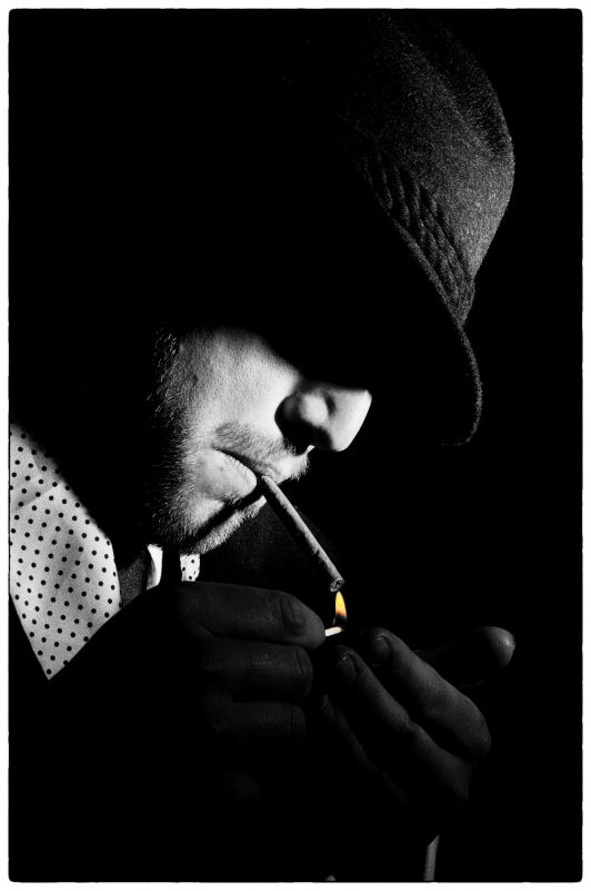 Male model photo shoot of noir studio