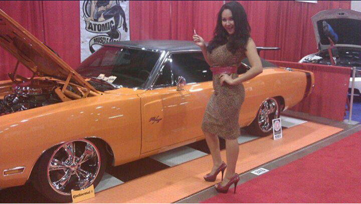 Female model photo shoot of Miss Schanell in SEMA car show