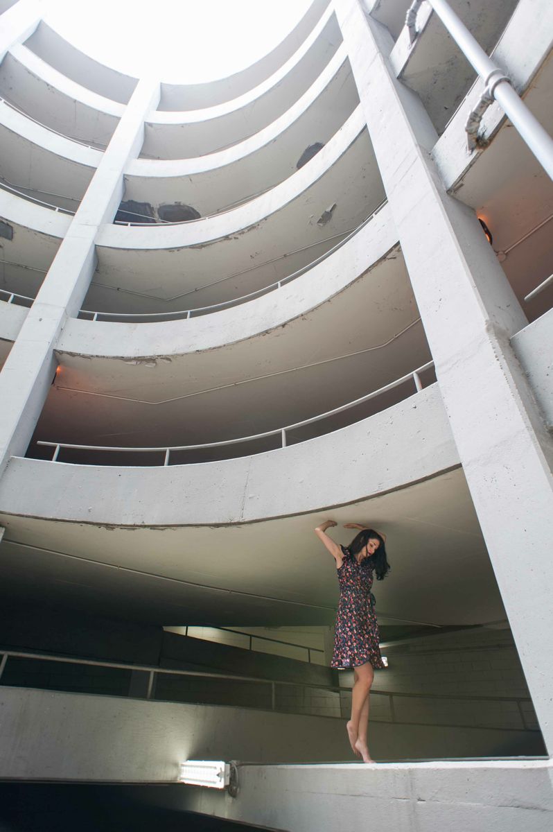 Female model photo shoot of Nichole Moore in parking deck, Richmond