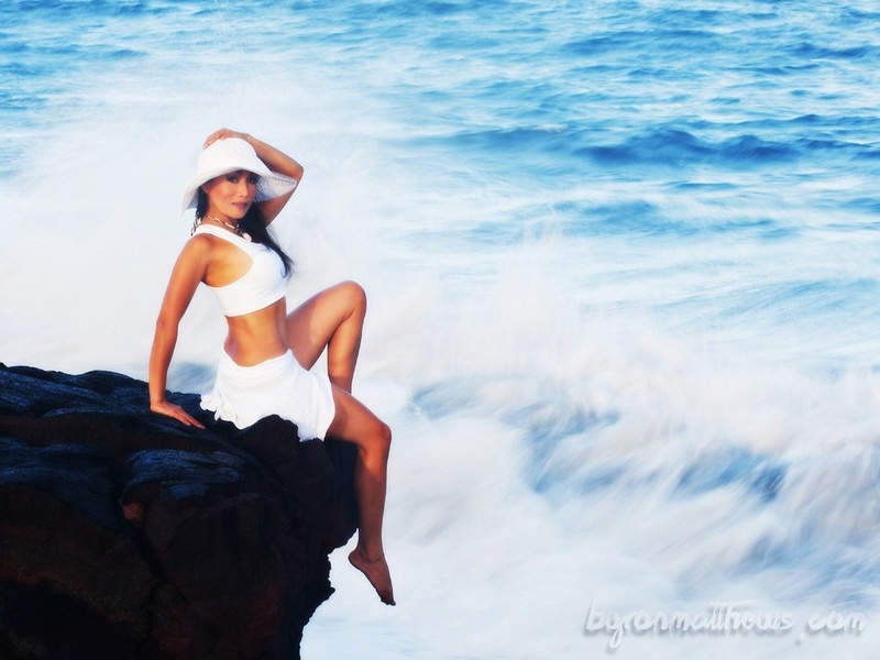 Female model photo shoot of NaiyanaEmpire by Byron Dee Photography in Black sand beach, lava cliff rock on big island Hawaii