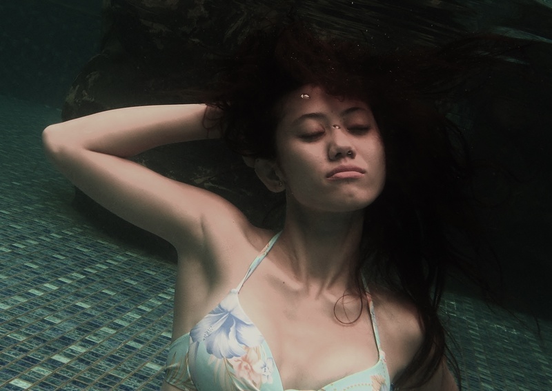 Female model photo shoot of Melan kwok in under water