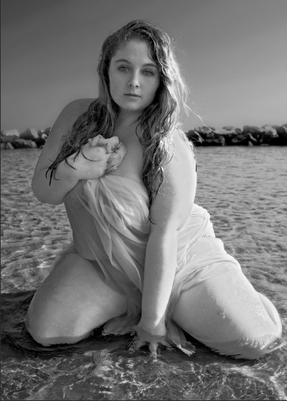 Female model photo shoot of Symphony Q by Of Brian Photography in Beach