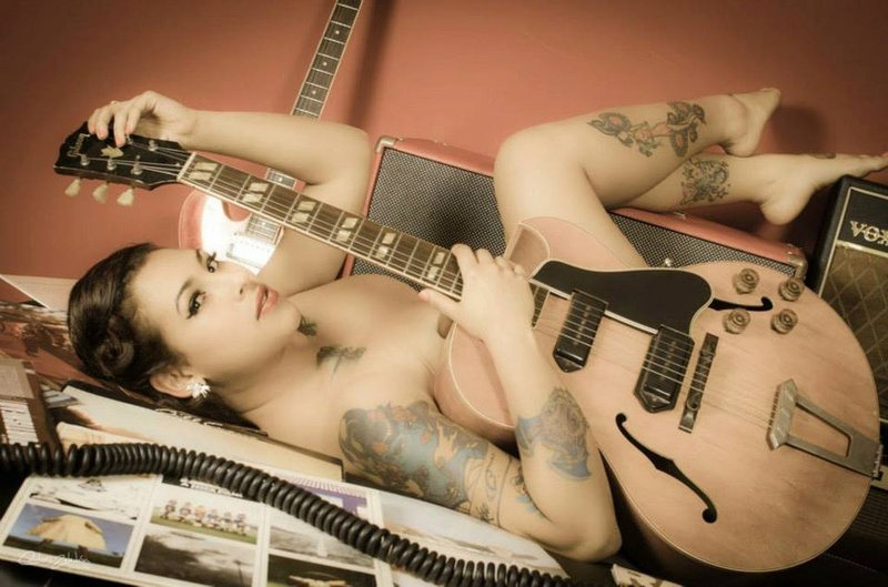Female model photo shoot of Adriana Chacon in Retro tone Guitars, San Jose, Costa Rica.