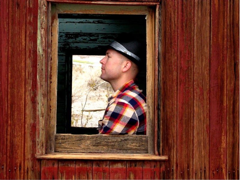 Male model photo shoot of Zack design in Death Valley (abandoned train car)