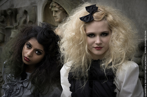 Female model photo shoot of Savija Ellis, Poppy Mills and Ashavari, clothing designed by Gloomth Clothing