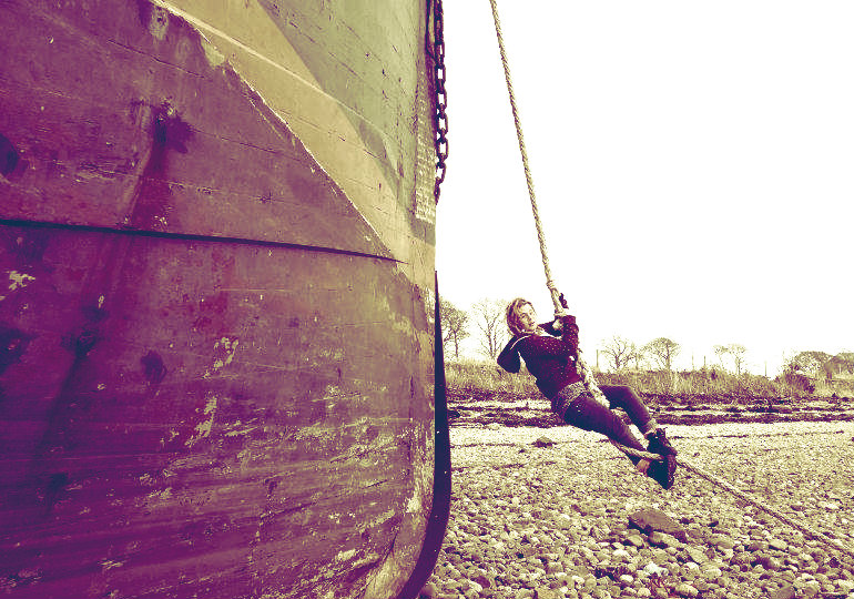 Female model photo shoot of Peroxide Socks in Abandoned secret boat