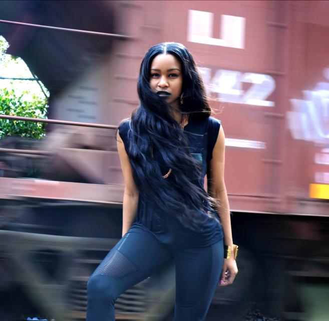 Female model photo shoot of Neek Millie in Train Tracks