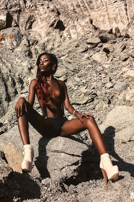 Female model photo shoot of Adrianne France in British Virgin Islands- concrete yard