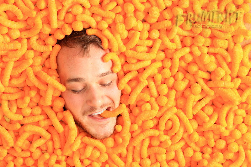 Male model photo shoot of DakotaDean in A bed of cheetos