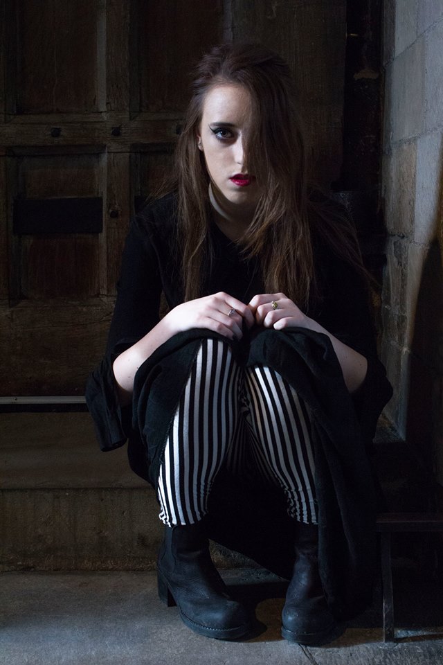 Female model photo shoot of Anna Bream in Norwich Cathedral.