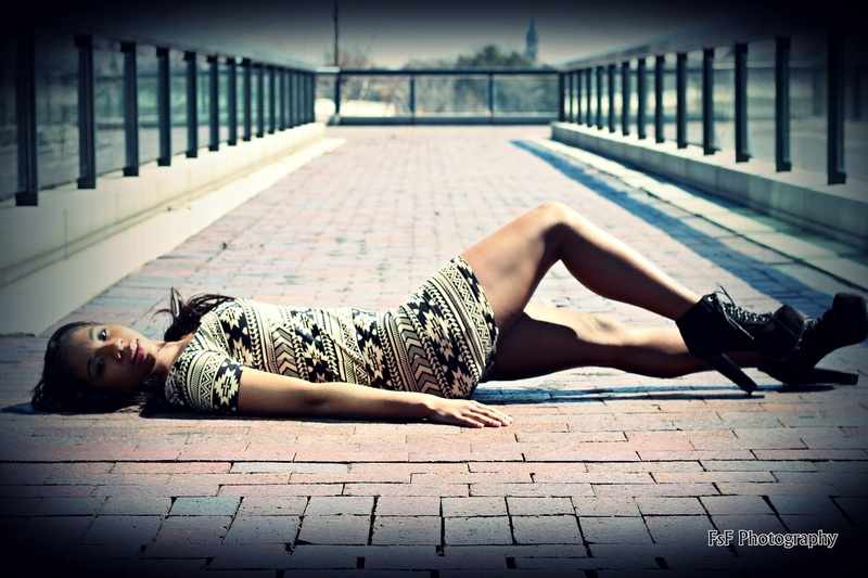 Female model photo shoot of Stormi Minnfield in downtown toledo