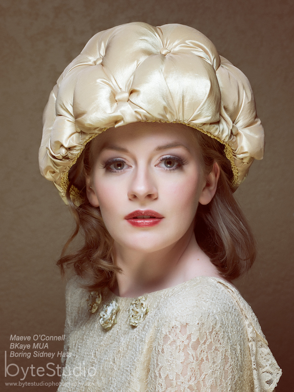 Female model photo shoot of BKaye MUA by ByteStudio, clothing designed by Boring Sidney Hats