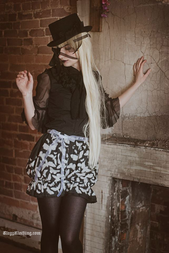 Female model photo shoot of Basil Grows by RachelLaurenPhotography, clothing designed by Elegy Clothing