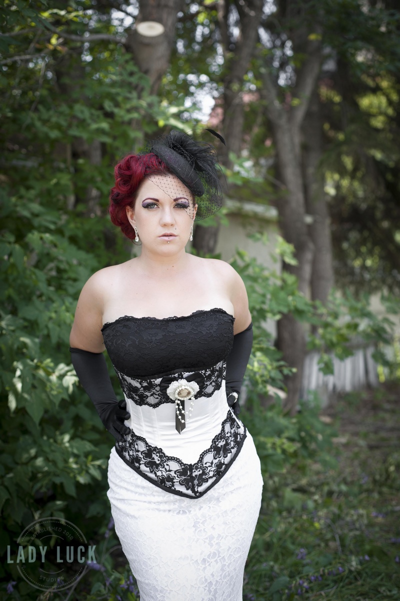 Female model photo shoot of Lady Luck Studios and Bettie Buxom in Edmonton, AB, clothing designed by dark_knits_boutique