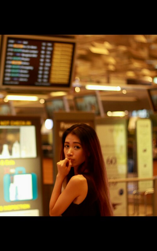 Female model photo shoot of EvelynM in Singapore Changi Airport