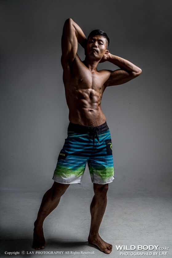 Male model photo shoot of Musclelogy Tan 