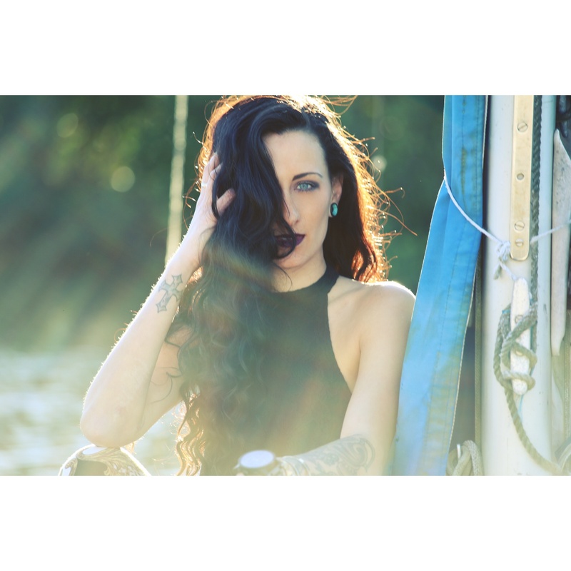 Female model photo shoot of desireelavalette by Kevin Smach in abandoned boat