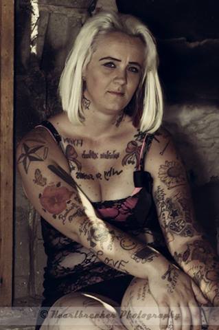 Female model photo shoot of tattooed southern belle in victorville california