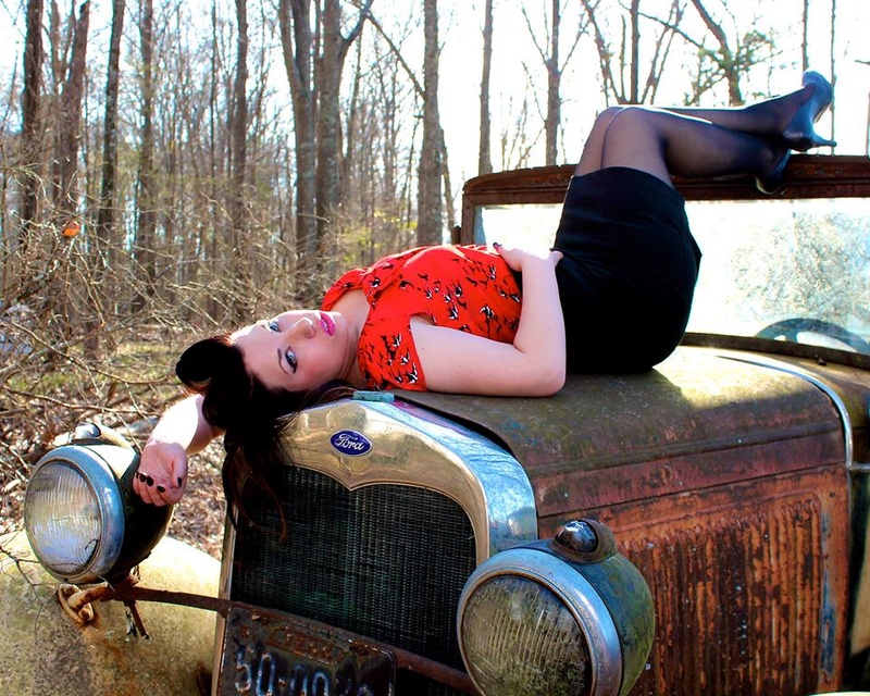 Female model photo shoot of Hellbomb Photography in Photo taken in a Car Graveyard