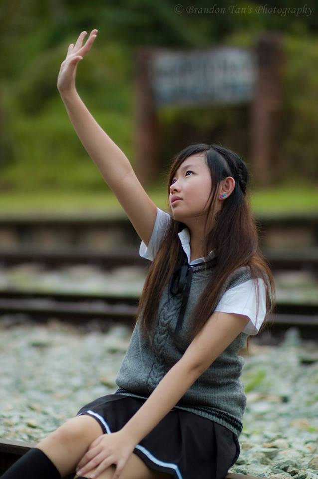 Female model photo shoot of CherylTan in Bukit Timah Railway Station