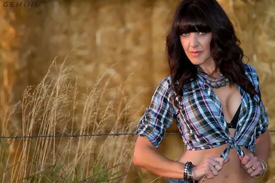 Female model photo shoot of Josie03 by Gemini Dragon  in hay field