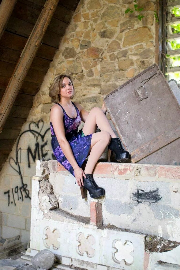 Female model photo shoot of MoraB by RHarsher in Creepy crypt ruin.