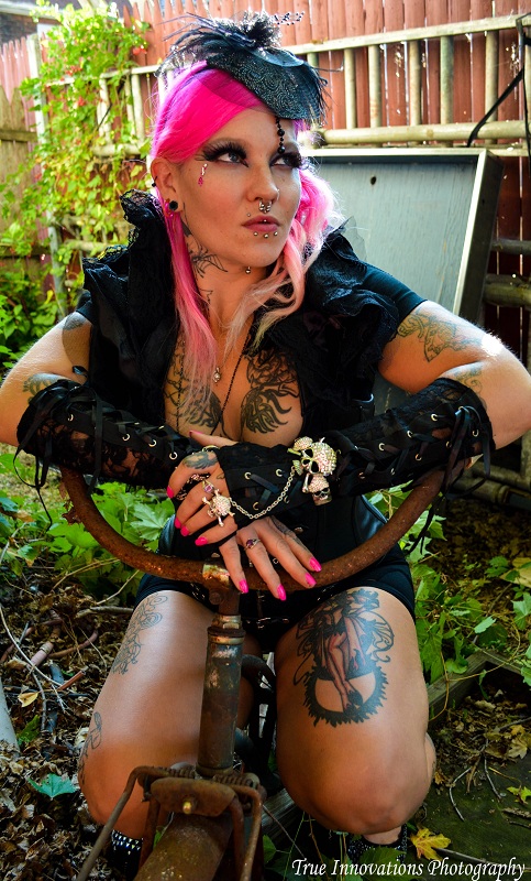 Female model photo shoot of Liz Stiletto in True Innovations Tattoos