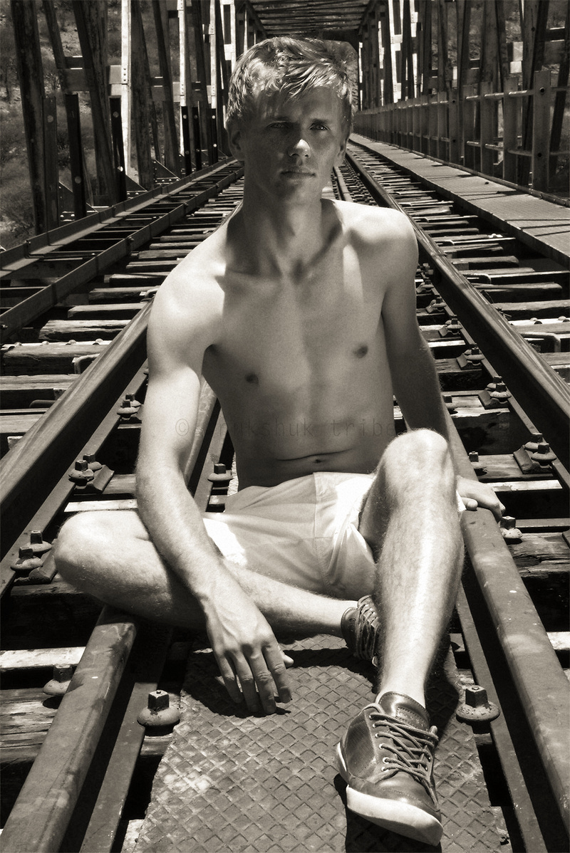 Male model photo shoot of Henko in Railway track