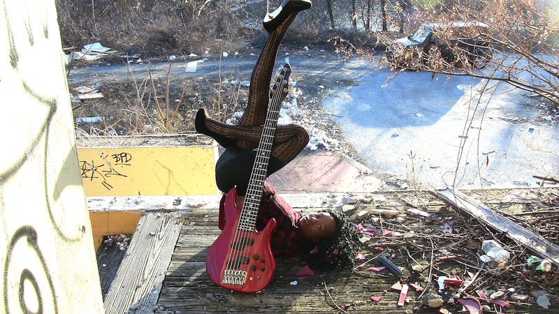 Male model photo shoot of Red Bass Guitar Modeling
