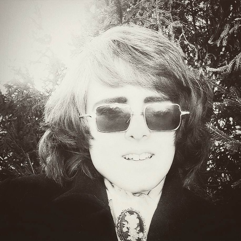 Male model photo shoot of Elton John Lennon