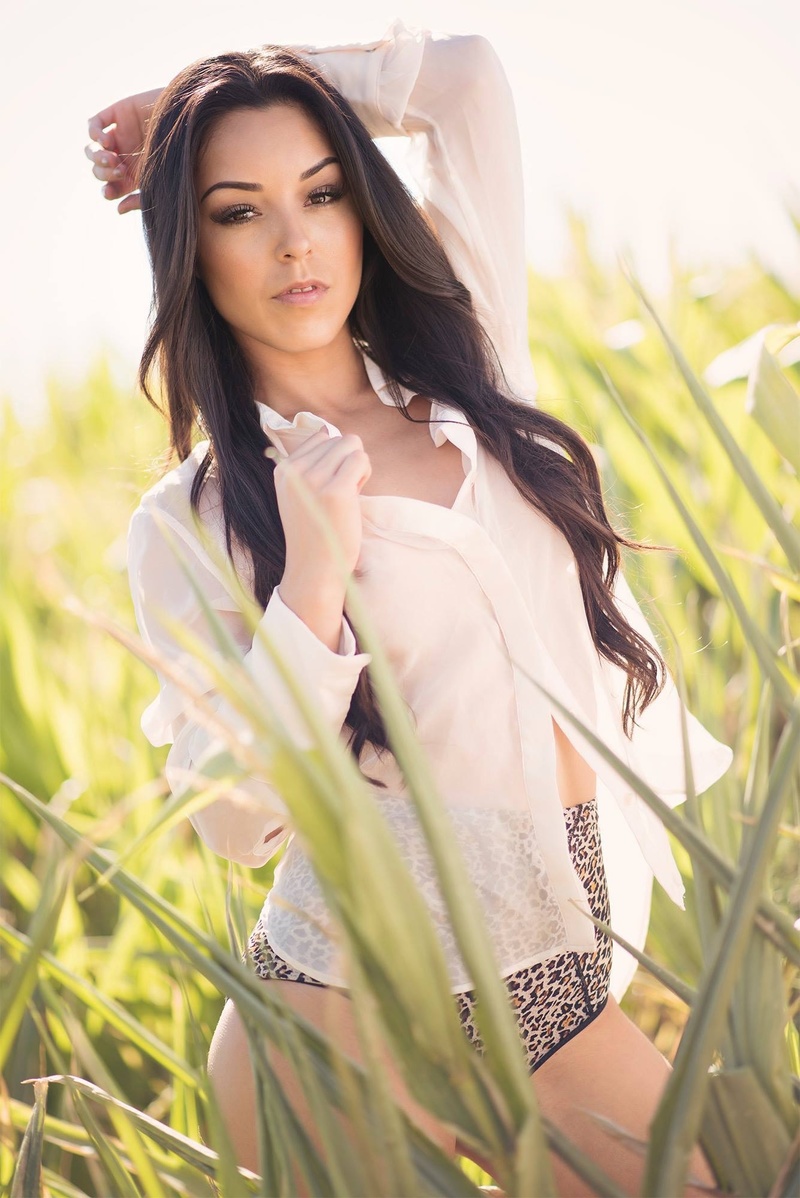 Female model photo shoot of Mayra T in Corn field