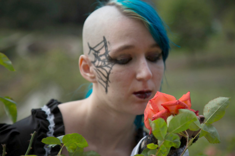 Female model photo shoot of HauntingRose23 in rose garden Oakland